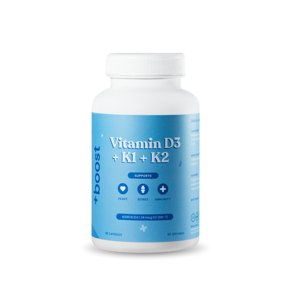 +boost Vitamin D3, K1, and K2 supplement bottle with label showing vitamins and dosage, placed on a white background.