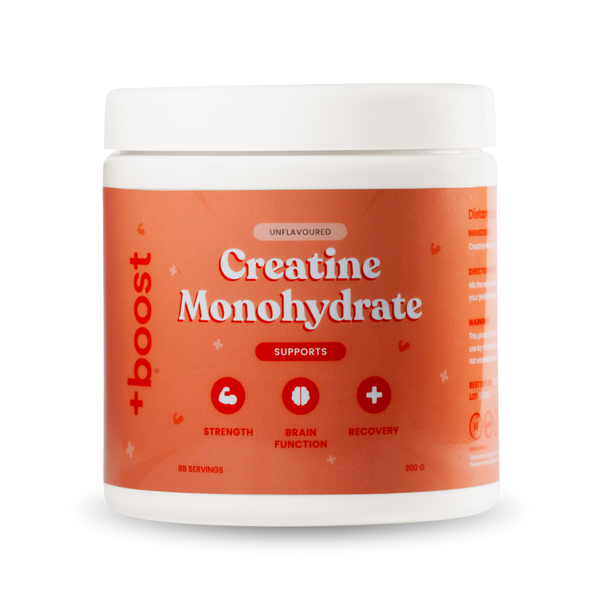 Container of +boost Creatine Monohydrate powder, showing the label with product details and brand name.