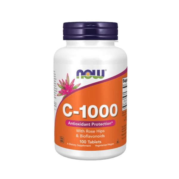 Now Foods Vitamin C-1000 tablets in a clear bottle with white and orange label, showing the supplement capsules inside.