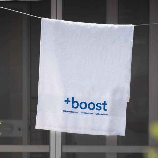 +boost gym towel featuring soft, absorbent fabric with +boost branding, ideal for workouts and fitness routines