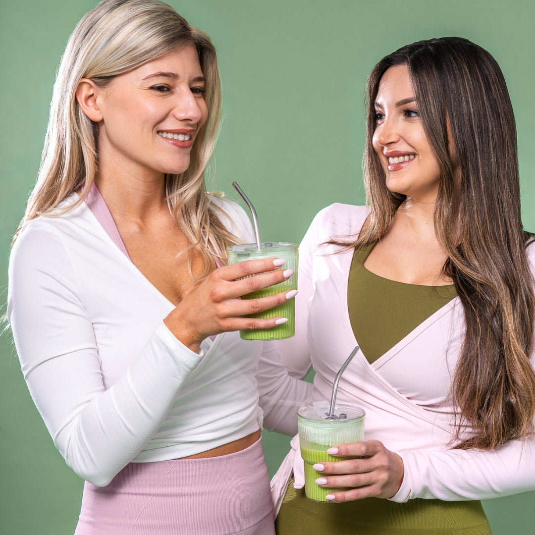 A +boost Matcha Latte in a glass mug, showcasing vibrant green matcha powder and creamy froth on top.